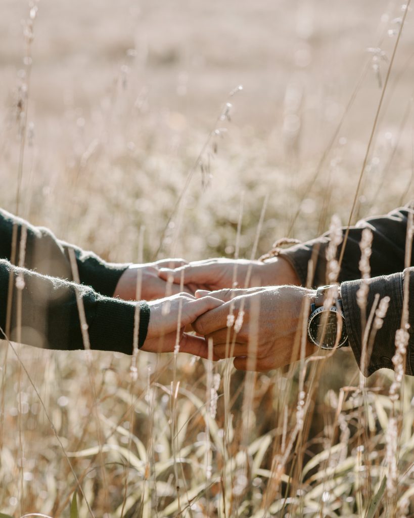 A couple holding hands.