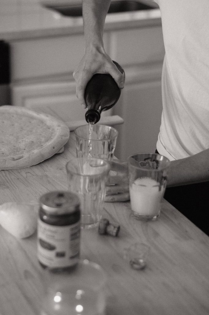 intimate engagement session in williamsburg brooklyn couple making homemade pizza